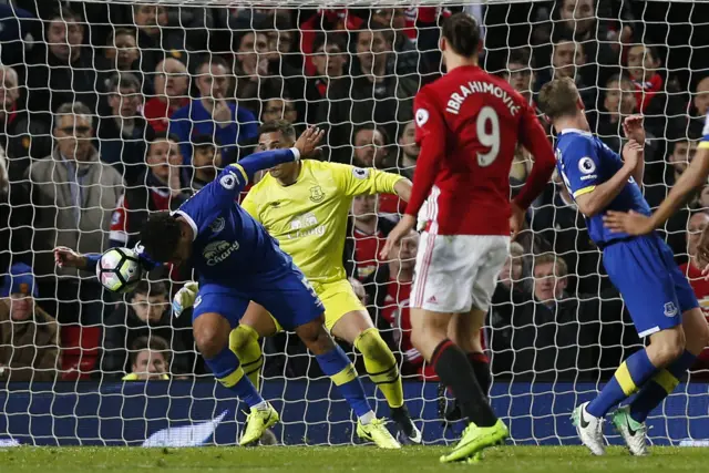 Ashley Williams handles the ball
