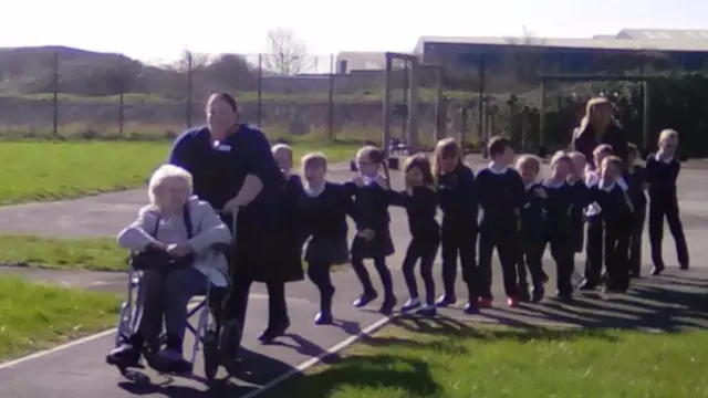 
          Pupils from Woodlands Primary School doing the conga with residents of Wilton Lodge
        