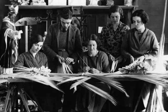 
          1936: Workers of Walsingham, Norfolk, were captured on camera making up palm crosses and branches to be carried in procession and distributed on Palm Sunday
        