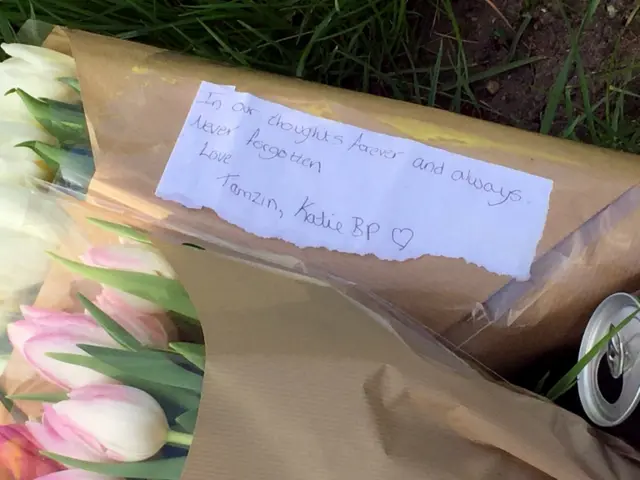 Pink tulips with a tribute to crash victims