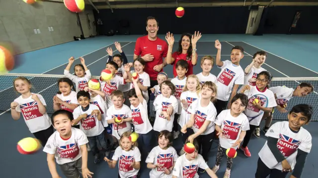 
          Greg Rusedski and Annabel Croft launch Tennis for Kids with some children
        