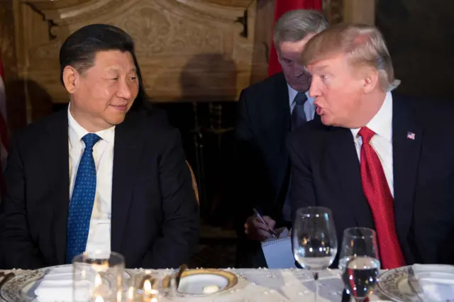 
          US President Donald Trump (R) and Chinese President Xi Jinping (L) speak during dinner at the Mar-a-Lago estate in West Palm Beach, Florida, on 6 April 2017.
        