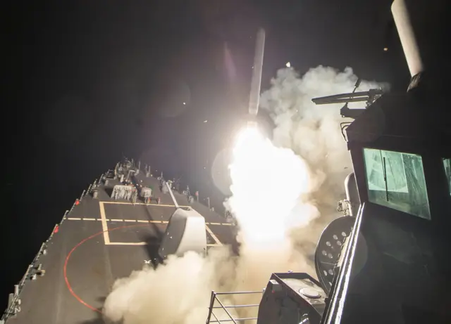 
          U.S. Navy guided-missile destroyer USS Ross (DDG 71) fires a tomahawk land attack missile in Mediterranean Sea which U.S. Defense Department said was a part of cruise missile strike against Syria on April 7, 2017
        