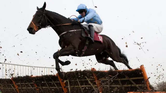 Danny Cook pictured riding Yesyoucan at Haydock in 2012