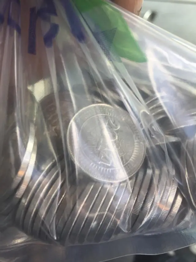 Big plastic bag of coins