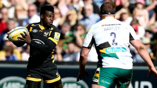 
          Christian Wade of Wasps challenged by Dylan Hartley of Northampton Saints
        