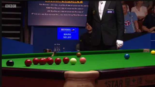 John Higgins hits a shot