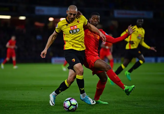 Nordin Amrabat of Watford is challenged by Georginio Wijnaldum