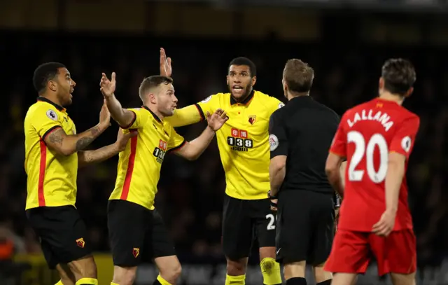 Capoue protests and is given a yellow card