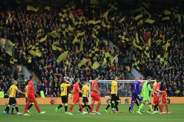 The teams walk out