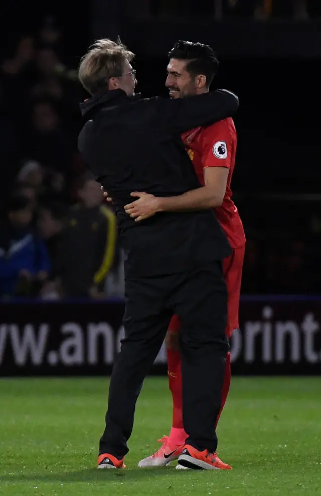 Can and Klopp hug