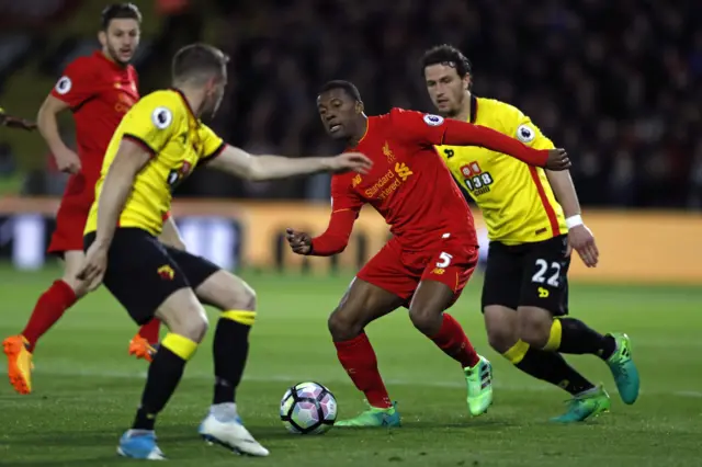 Georginio Wijnaldum vies with Watford"s Tom Cleverley and Daryl Janmaat