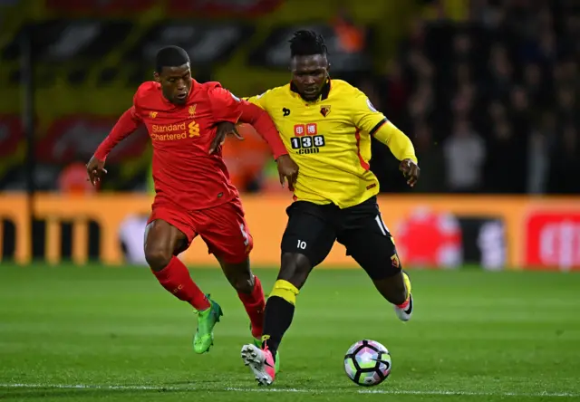 Isaac Success of Watford holds off Georginio Wijnaldum of Liverpool