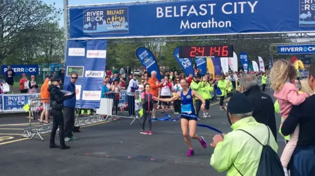 Laura Graham crosses the finish line