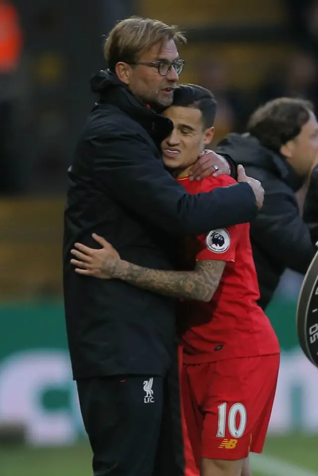 Philippe Coutinho hugs Jurgen Klopp