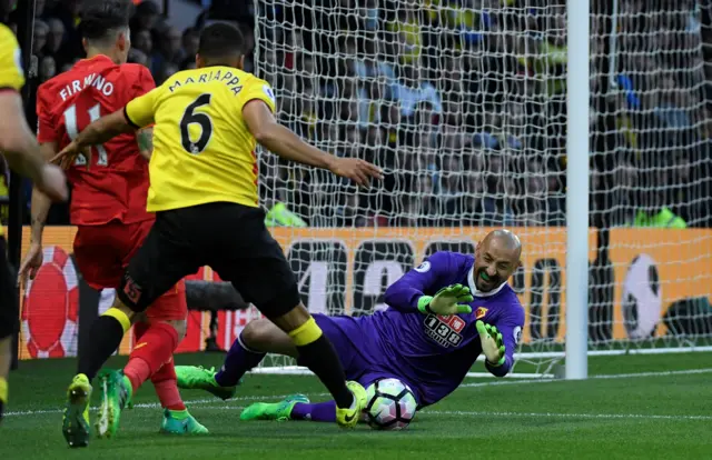 Roberto Firmino in action with Watford"s Heurelho Gomes and Adrian Mariappa