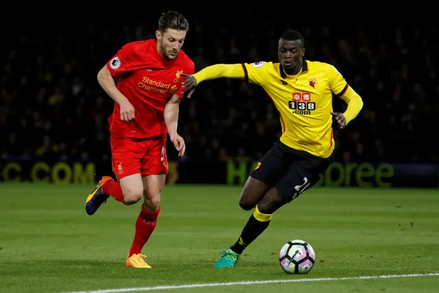 Adam Lallana in action with Watford"s M"Baye Niang