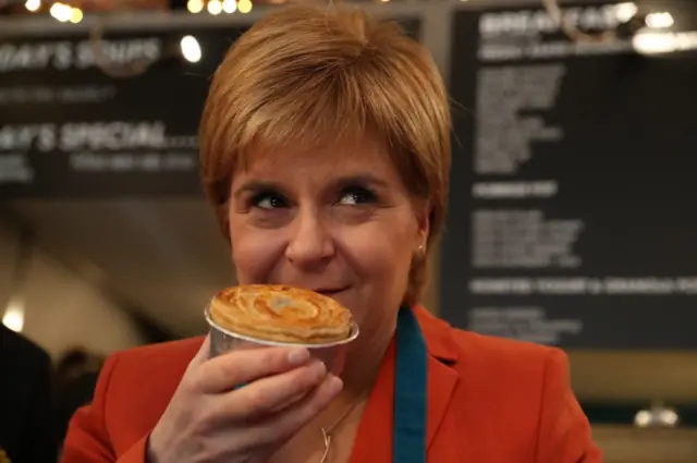 Nicola Sturgeon makes pie with an SNP logo