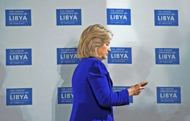 US Secretary of State Hillary Clinton checks her telephone before the opening of the Libyan Conference in London. 29/03/2011