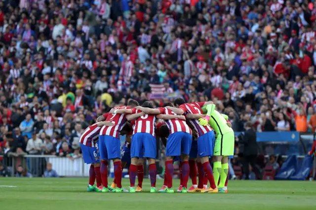 Atletico players huddle