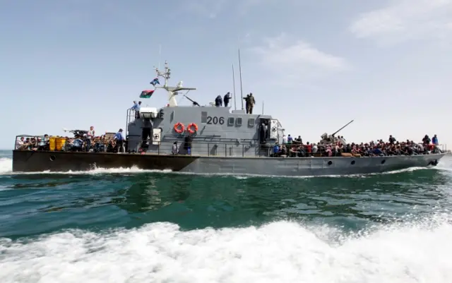 llegal migrants arrive by boat at a naval base after they were rescued by Libyan coastguard in the coastal city of Tripoli, Libya, May 10, 2017