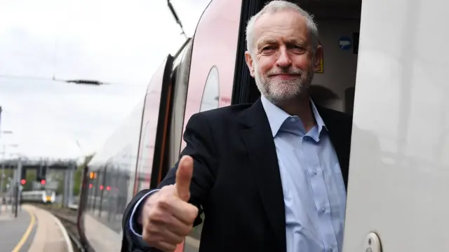 Labour leader Jeremy Corbyn boards a train in Bedford, 3 May 2017