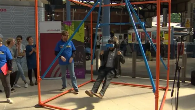 Festival director on playground swing