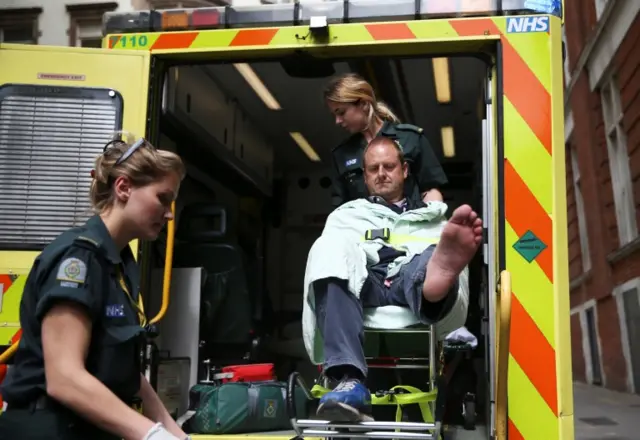 BBC cameraman in back of ambulance