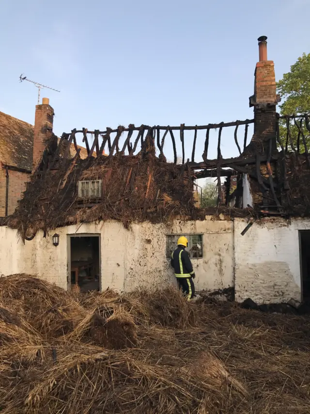 Thatched cottage fire