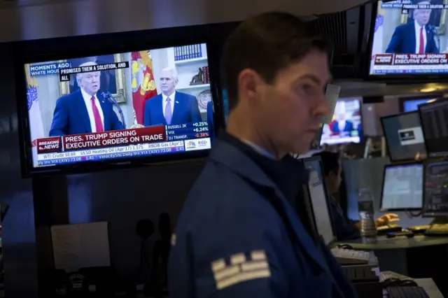 Donald Trump is displayed on TV monitors at the New York Stock Exchange