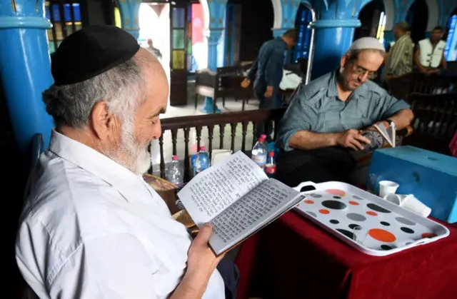 People praying in the synagogue