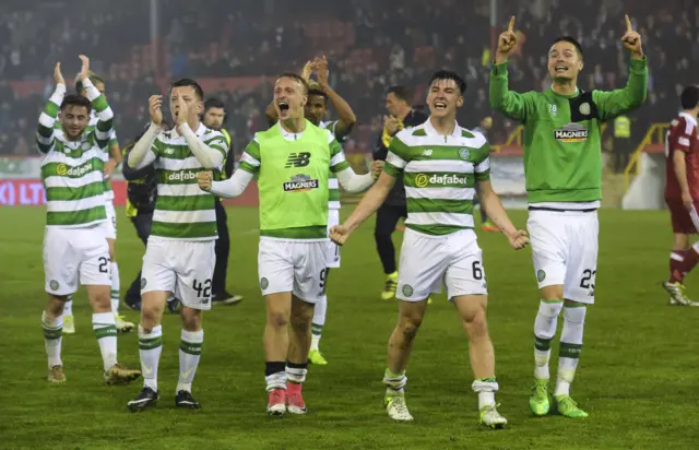 The Celtic players whip their fans into a frenzy after reaching 100 points in the Premiership