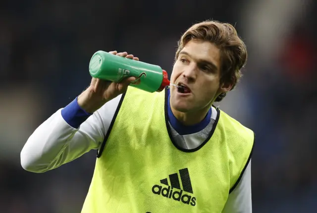 Marcos Alonso warms up