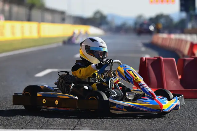 A child races a go kart in Barcelona