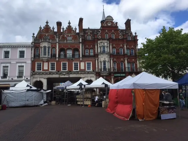 Cornhill, Ipswich with market in the foreground