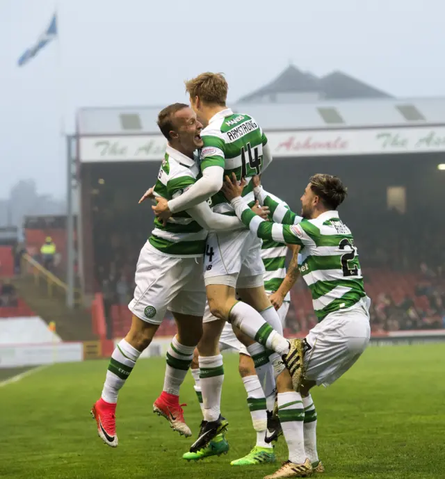 Leigh Griffiths and Stuart Armstrong celebrate the midfielder's goal, Celtic's second, at Pittodrie