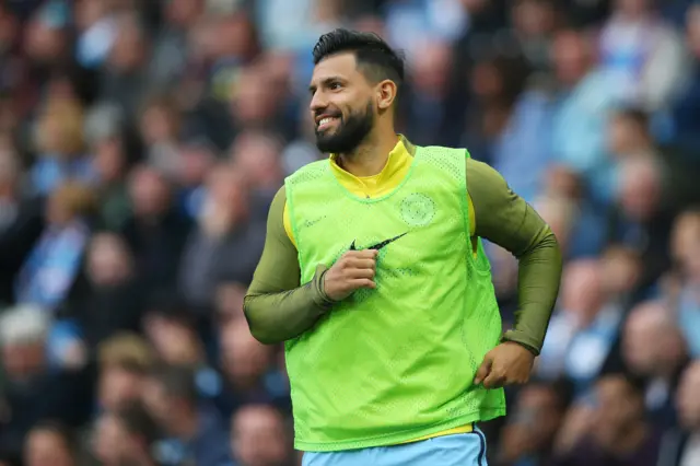 Sergio Aguero warms up