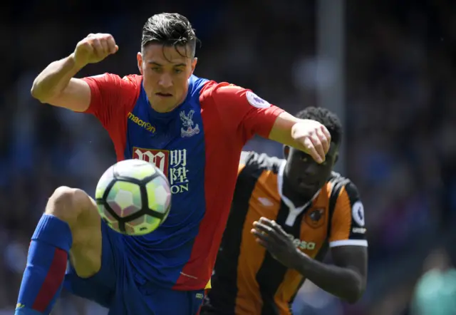 Martin Kelly controls the ball