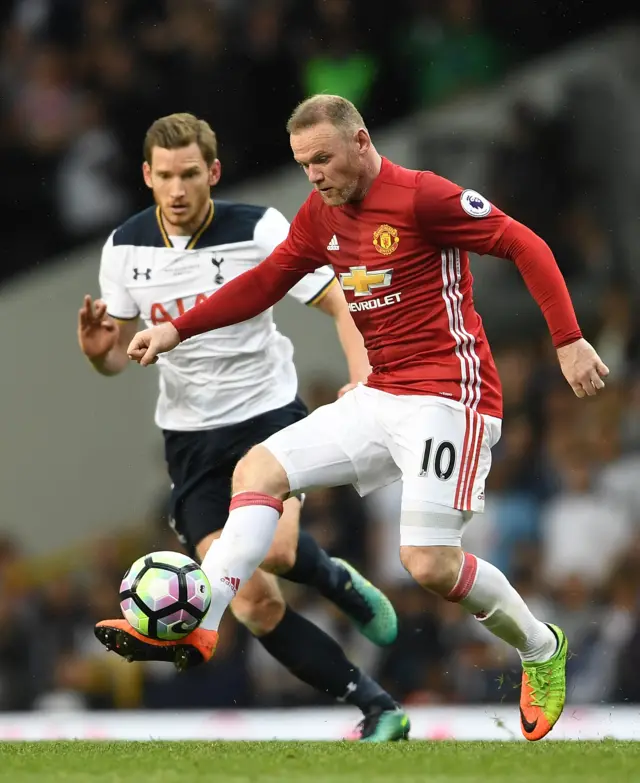 Wayne Rooney holds the ball