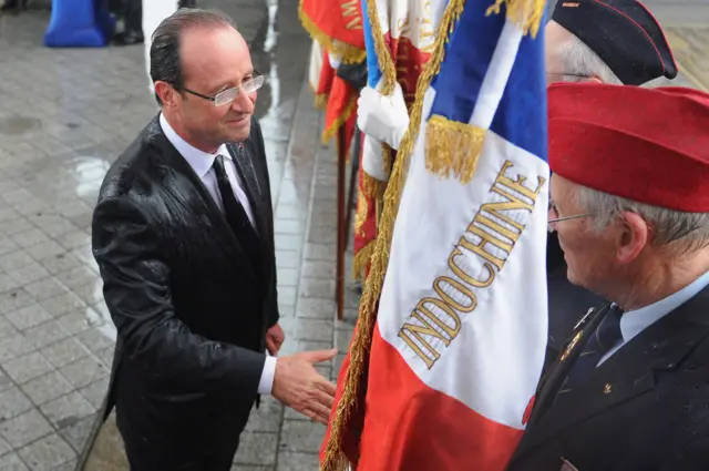 French President Francois Hollande shakes hands with veterans during a ceremony to the Unknown soldier at Arc de Triomphe on May 15, 2012 in Paris, France