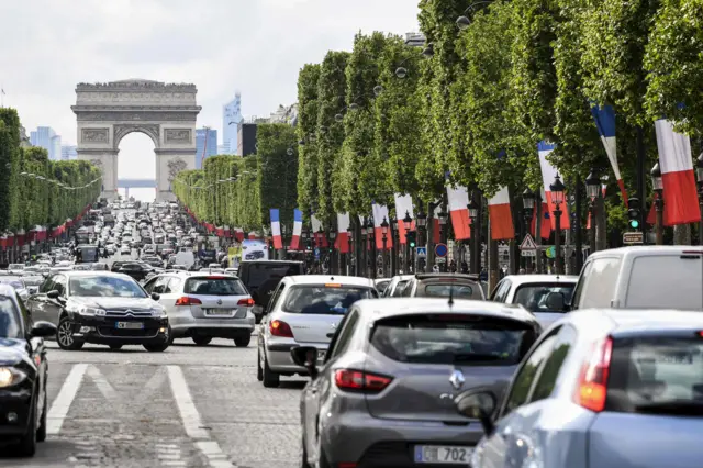 Flags lined the streets the Champs-Elysees avenue in Paris on Saturday, the eve of the handover of power to French president-elect Emmanuel Macron, 13 May 2017