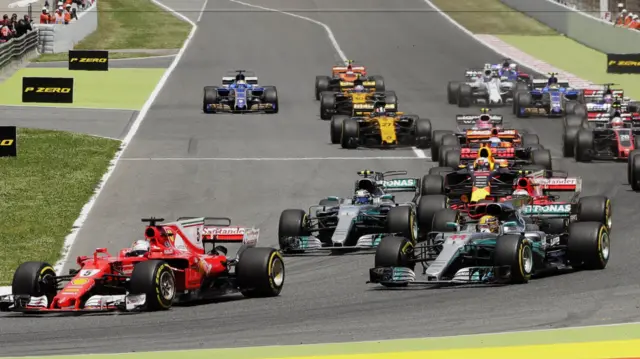 Sebastien Vettel passes Lewis Hamilton