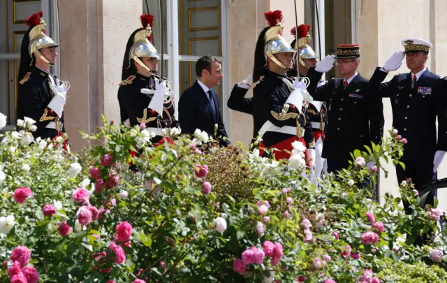 French President Emmanuel Macron (C) reviews troops in the gardens of the Elysee presidential Palace following his formal inauguration ceremony as French President on May 14, 2017 in Paris.