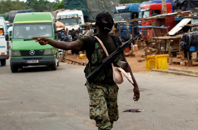 Masked solider on the street