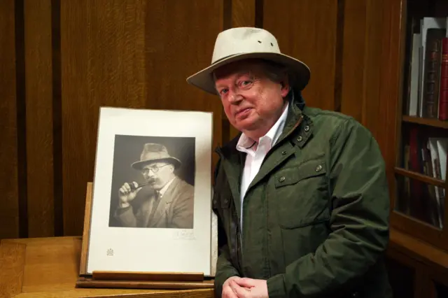 John Sargeant with a photo of Arthur Ransome