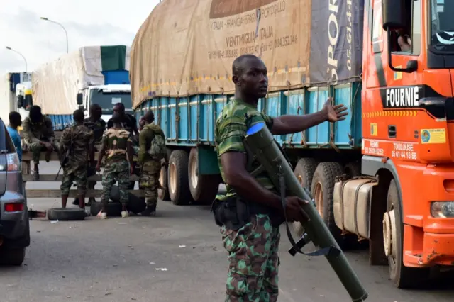 Solider on the streets with a large weapon