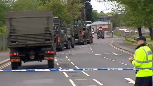 Army trucks arriving at scene