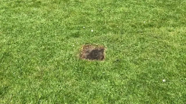 Scorch mark on grass