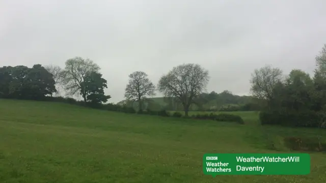 Cloudy skies over a field in Daventry.