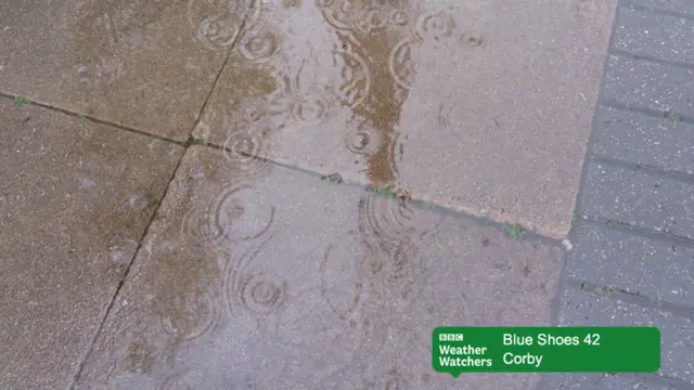 Rain falling into a puddle in Corby.